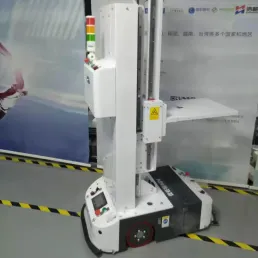 Automatic charging, low-profile lifting, stacking, palletizing, and assembling of cartons, boxes, and frames - AGV 
